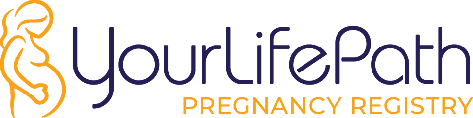Woman in advanced pregnancy browsing baby clothes in baby's room