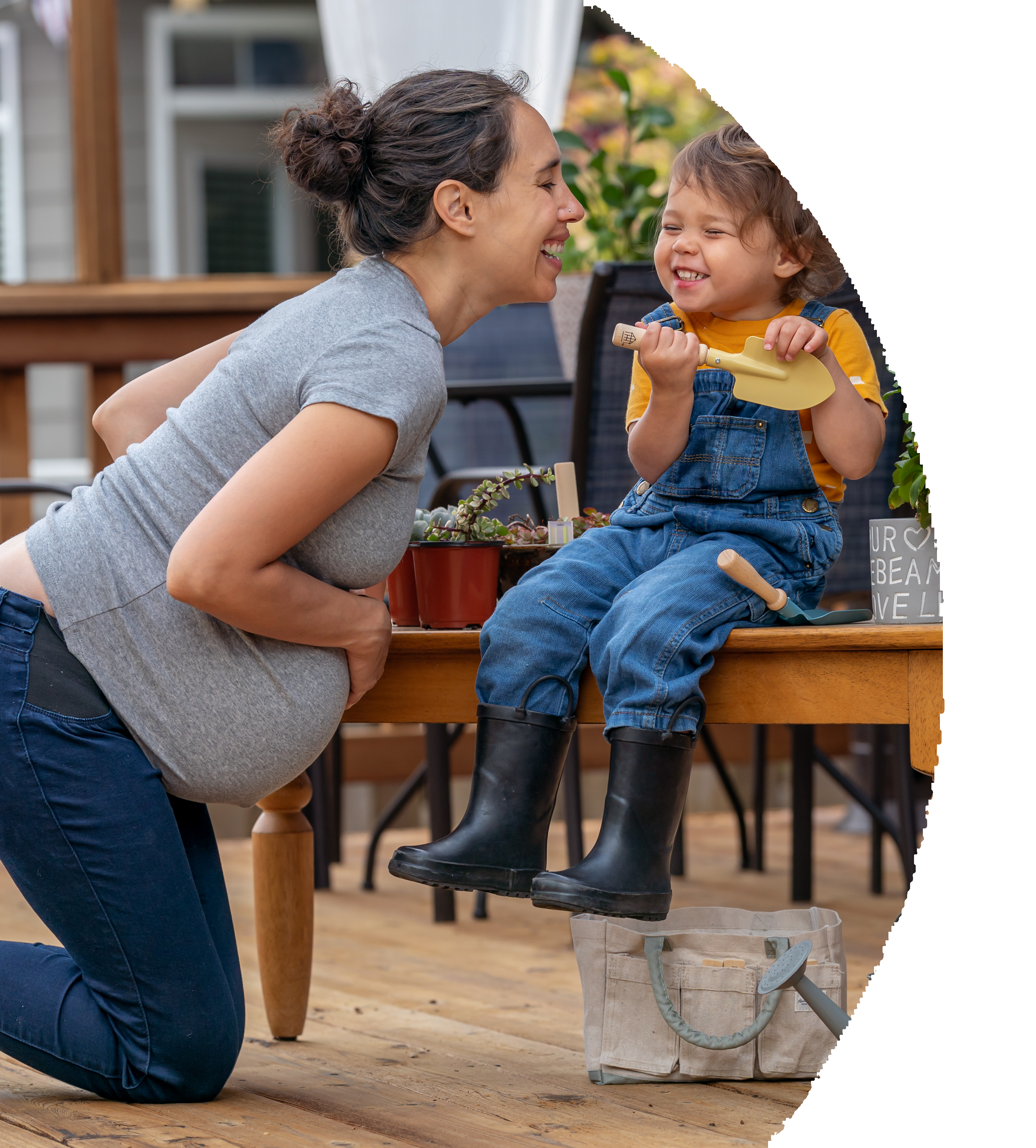 Mom and daughter having fun outside on patio